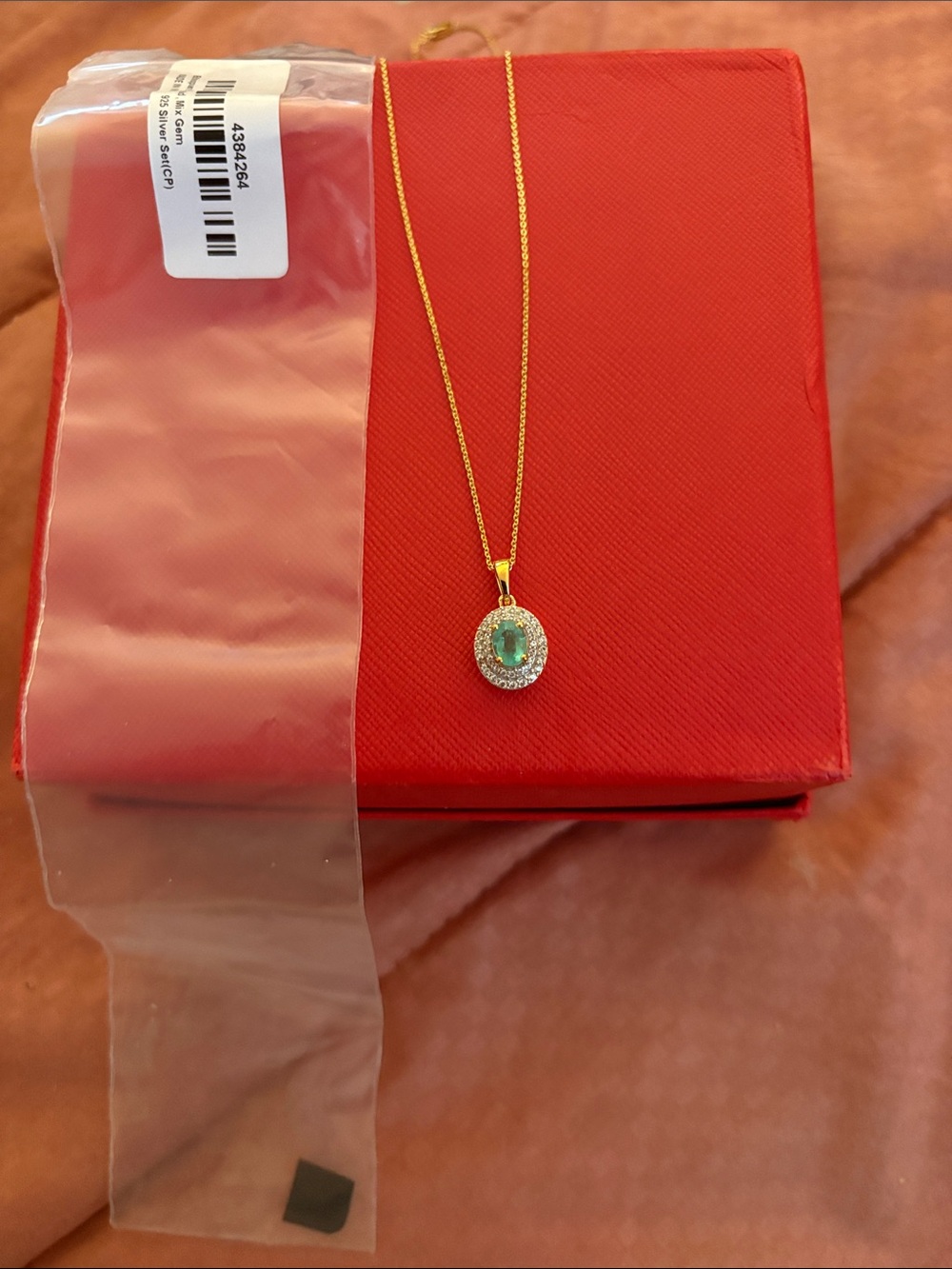 Gold Necklace with Green Oval Gem and Halo Pendant